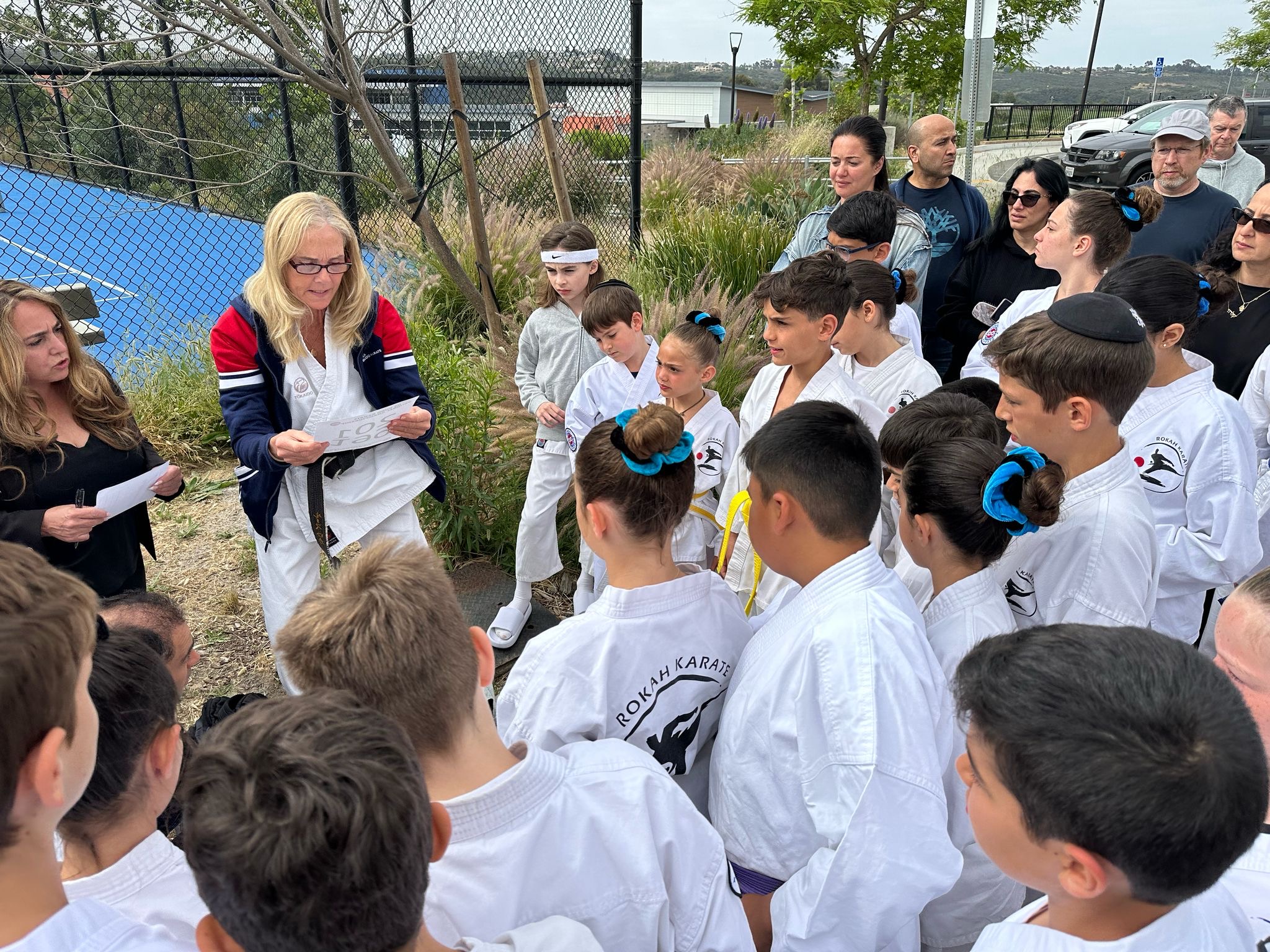 Sensei Ruth with students at an outdoor dojo event