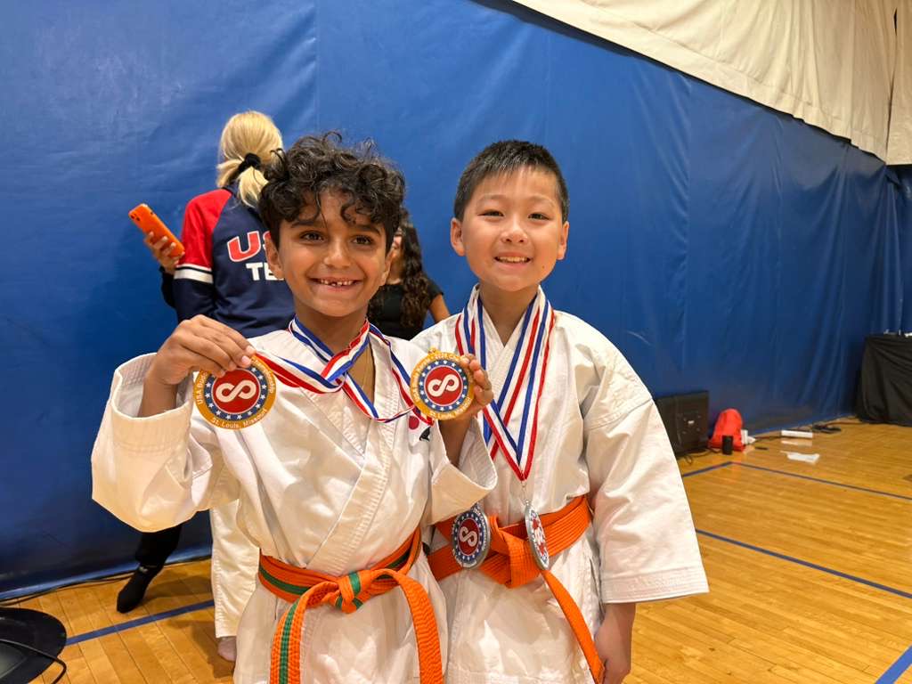 Two young Rokah Karate students with tournament medals