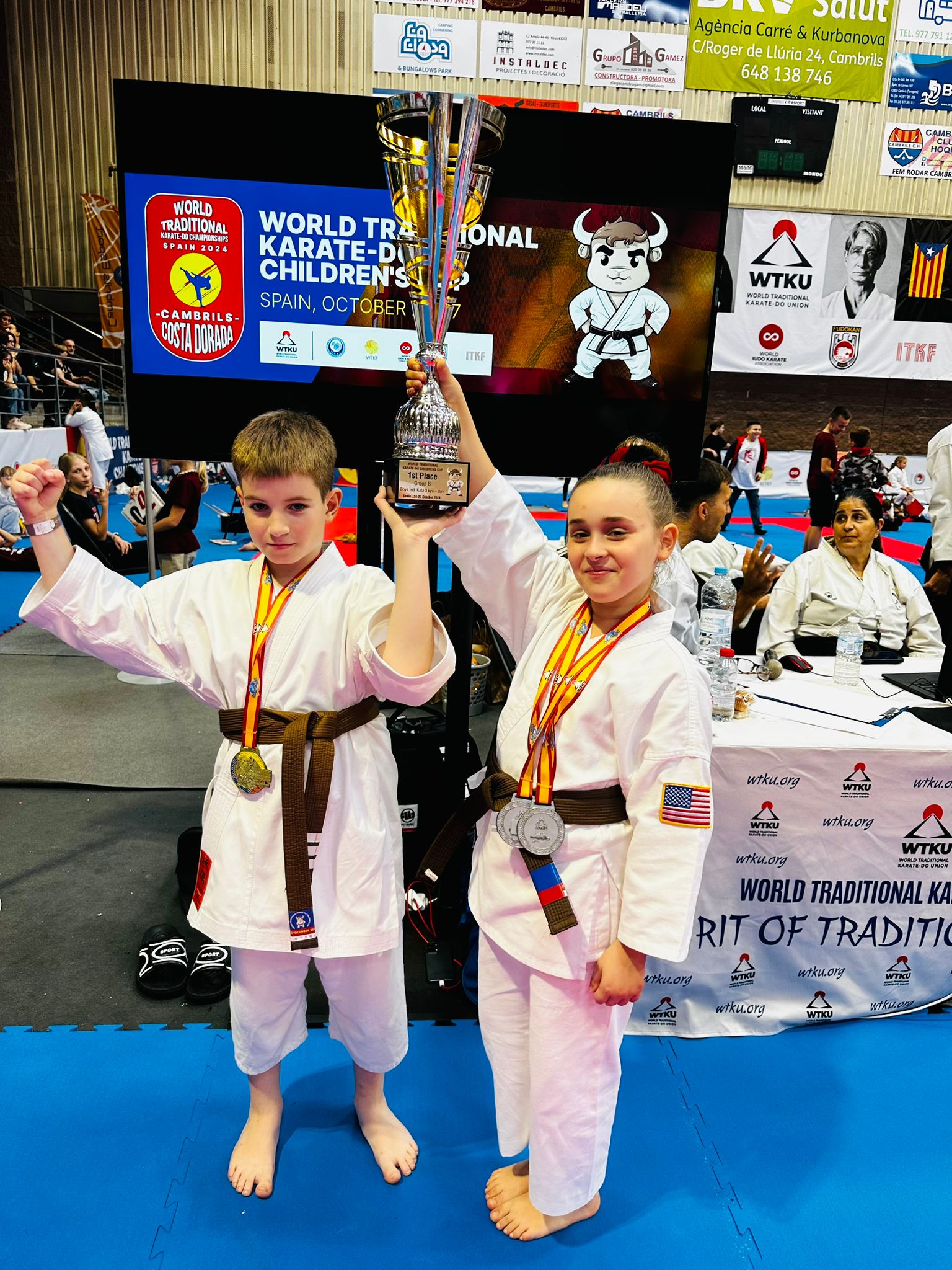 Rokah Karate students with a first-place trophy at the World Traditional Karate-Do Championships
